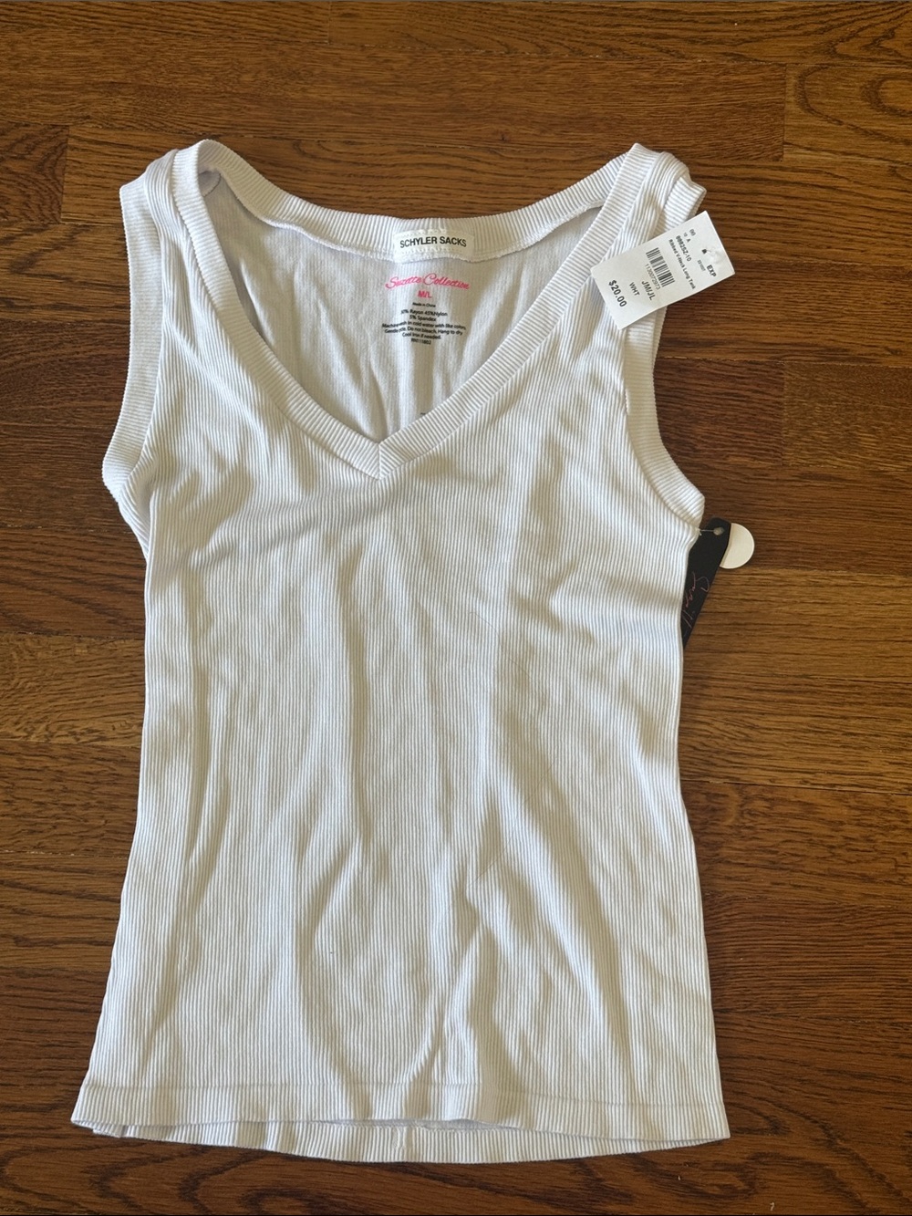 Women’s White Ribbed V-Neck Tank new with tags but does have a name label